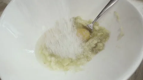 Adding sugar over bowl Stock Footage 55689499
