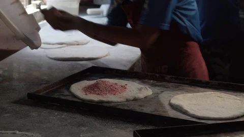 Adding sweeteners inside chapatis for baking in bakery Stock Footage 113204803