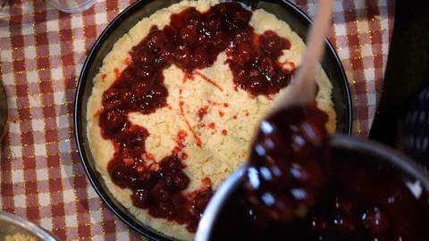 Adding tasty delicious toppings Cherries. Baking Pie. Isolated close-up. Stock Footage 124033712