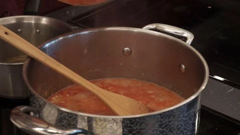 Adding tomato mash to rice Stock Footage 112127109