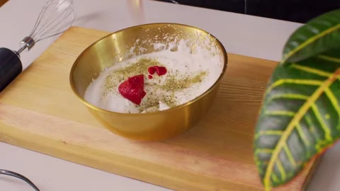 Adding tomato paste to beaten egg whites 動画素材 312720393