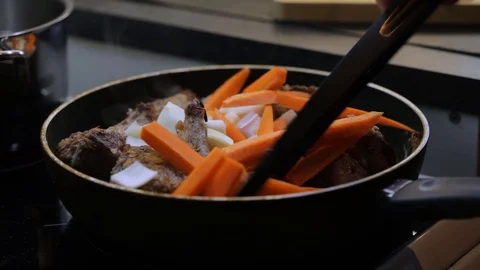 Adding tomato puree to beef Stock Footage 120462747