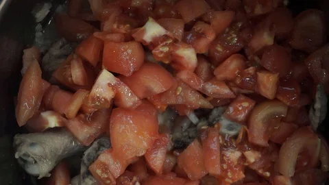 Adding tomato puree to braised chicken overhead Stock Footage 121118562