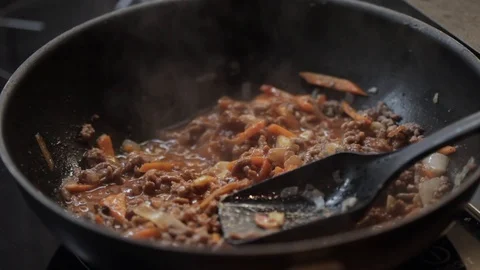 Adding tomatoes closeup Stock Footage 97411169