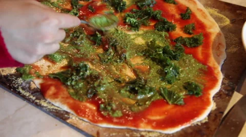 Adding toppings to a  homemade pizza Stock Footage 45501273