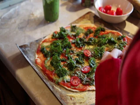Adding toppings to a  homemade pizza Stock Footage 45508211
