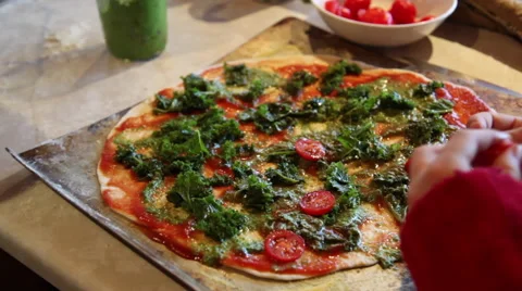Adding toppings to a  homemade pizza Stock Footage 45515103