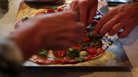 Adding toppings to a  homemade pizza Stock Footage 45515323
