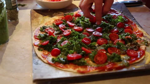 Adding toppings to a  homemade pizza Stock Footage 45515491
