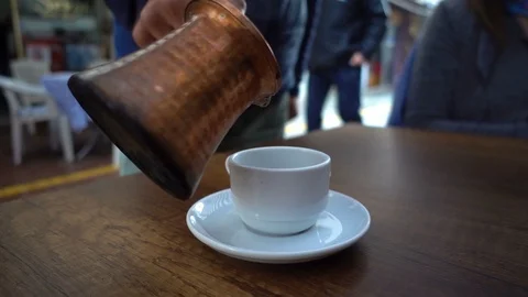 Adding Turkish Coffee in a Cup Stock Footage 104893314
