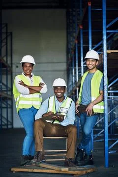 Adding value into everything we do. Portrait of a group of builders working at a Stock Photos
