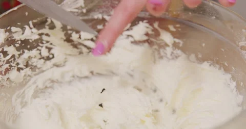 Adding vanilla bean into mixing bowl Stock Footage 249367331