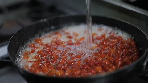 Adding Water on Bubbling Aromatic Chili Sauce Stock Footage 129327561