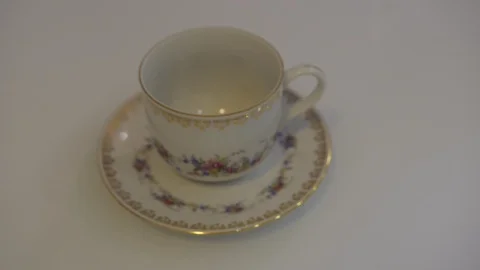 Adding water to a Cup of coffee, located in a white Cup on a white table Stock Footage 97460003