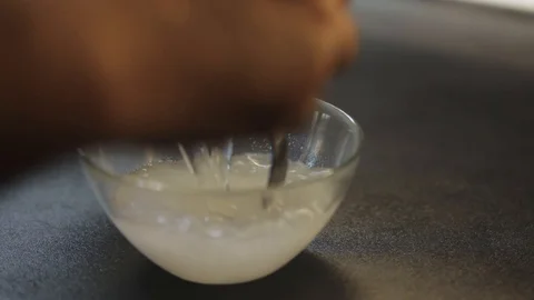 Adding water to jelly mix Stock Footage 97410923