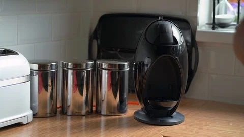 Adding water to pod coffee machine Stock Footage 129936350