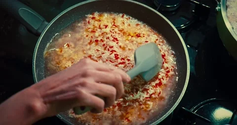 Adding water to rice meal Stockbeeldmateriaal 167431805