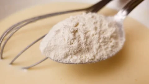 Adding wheat flour to the dough, recipe for making pie dough. Stock Footage 304991291