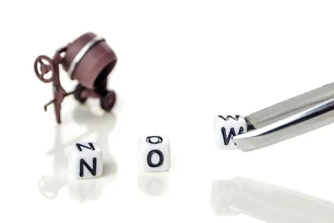 Adding white cube with letter w to the word no creating new word now on white Stock Photos