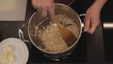 Adding wine to rice overhead Stock Footage 112127487