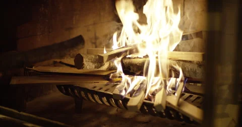 Adding wood to the fire Stock Footage 56922036