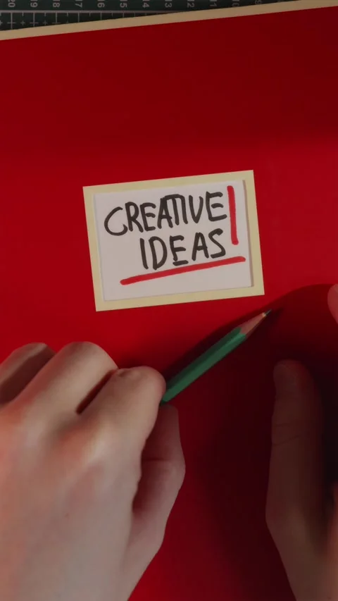 Adding wooden pencil next to Creative Ideas red journal Stock Footage 341246060