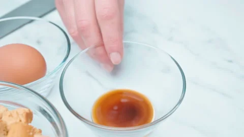 Adding Worcestershire to a Caesar Salad Sauce mixture in 4K. Stock Footage 140766961