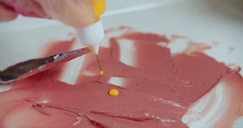 Adding yellow pigment to lipstick mixture Stock Footage 314601958