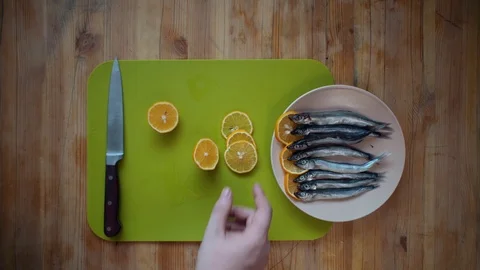 Addition to fish small pieces of lemon. Stock Footage 106529518