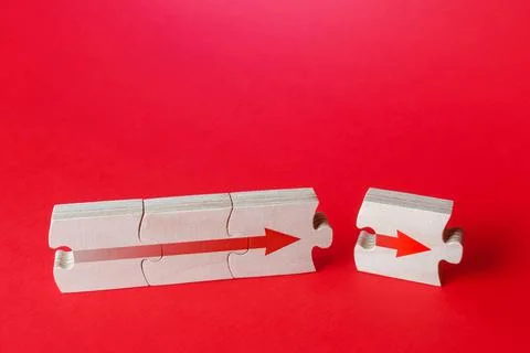 An additional puzzle with an arrow to the existing assembly. Continuation of  Stock Photos