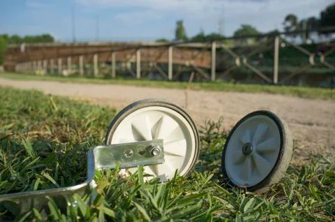 Additional wheels lying on the grass in the park Stock Photos