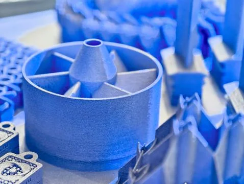 Additive manufacturing process showcasing various metal products created through 写真素材