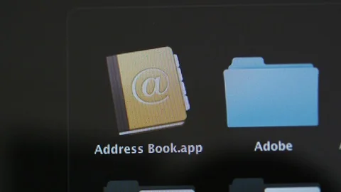 Address book and Adobe folder app Apple MacOS on iMac computers Stock Footage 103116212