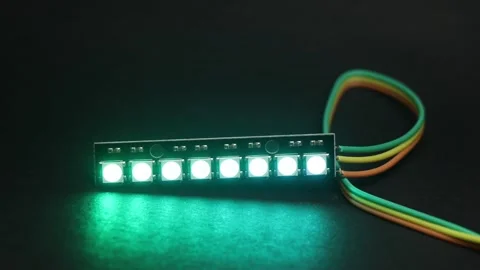 Addressable RGB LED strip with 8 individually controlled glowing LEDs Stock Footage 336626399