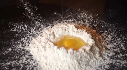 Adds eggs into dough Vídeo Stock 35037993