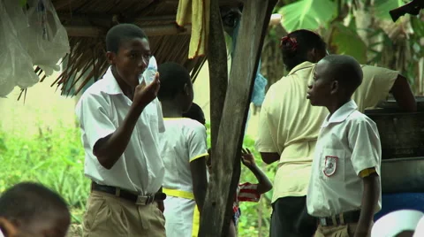 ADEISO BOY STUDENTS DRINK SACHET WATER Stock Footage 58066280