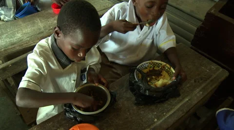 ADEISO BOY STUDENTS EAT LUNCH Stock Footage 58066258