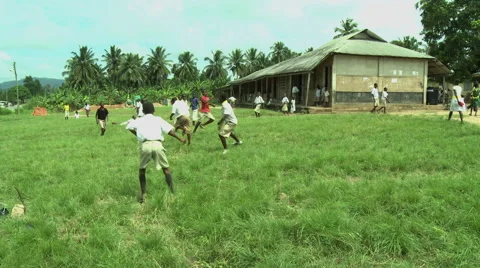 ADEISO BOY STUDENTS PLAY SOCCER Stock Footage 58066336