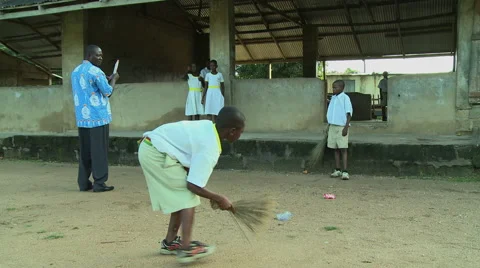 ADEISO BOY STUDENTS SWEEP SCHOOL Stock Footage 58066505