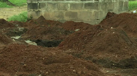 ADEISO RAIN ON A PILE OF DIRT Stock Footage 57982865