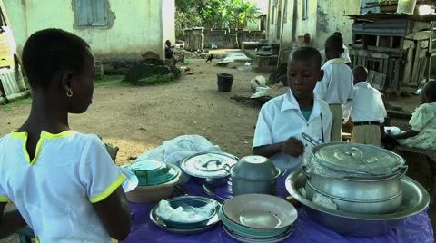 ADEISO SCHOOL LUNCH: BOY STUDENT GIVES CHANGE Stock Footage 58067458