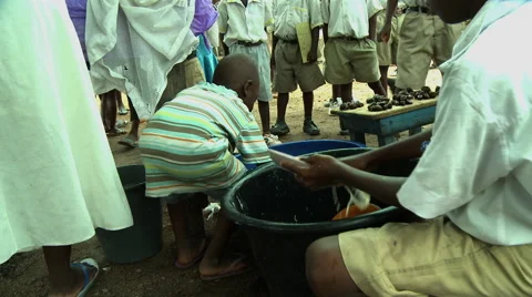 ADEISO SCHOOL LUNCH: BOY STUDENT PULLS OUT DISH AND SPOON Stock Footage 58067599