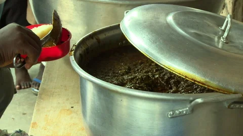 ADEISO SCHOOL LUNCH: CLOSE UP OF SERVING POT OF FOOD Stock Footage 58068006