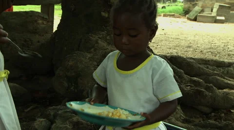 ADEISO SCHOOL LUNCH: YOUNG ADEISO GIRL STUDENT EATS Stock Footage 58069000