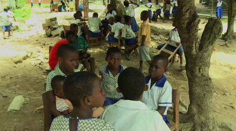 ADEISO STUDENTS SIT OUTSIDE A SCHOOL Stock Footage 58069291