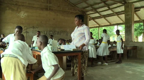 ADEISO WIDE ON TEACHER AND STUDENTS IN CLASSROOM Stock Footage 57981651
