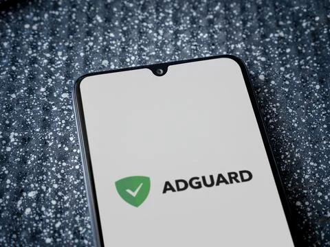 AdGuard app launch screen on smartphone on metallic background Stock Photos
