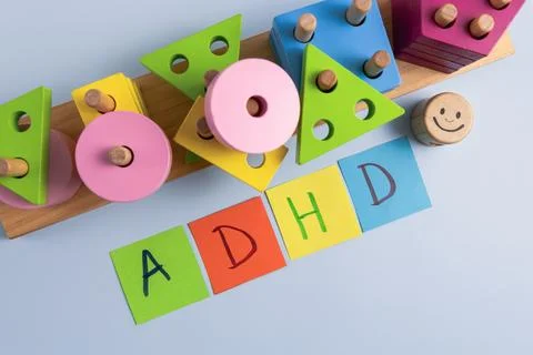 ADHD abbreviation on multi-colored paper and colorful blocks. Stock Photos
