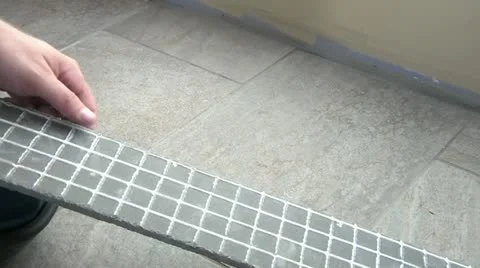 Adhering Tile Edging to Wall Video stock 12570837