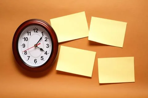 Adhesive notes and clock Stock Photos